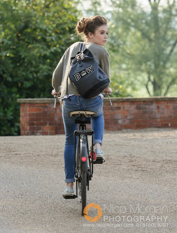 Model riding a bicycle for Apatchy