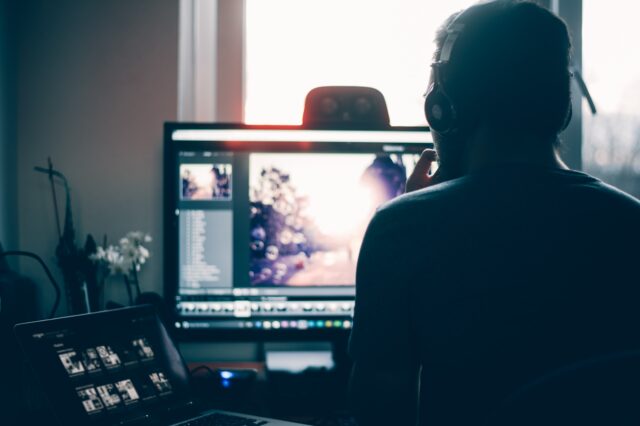 web design in Leicestershire - stock image of person editing on a computer